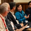 Dawn Wellman speaking to other people sitting on a panel presentation